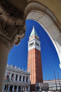 Low angle view of historical building against clear blue sky