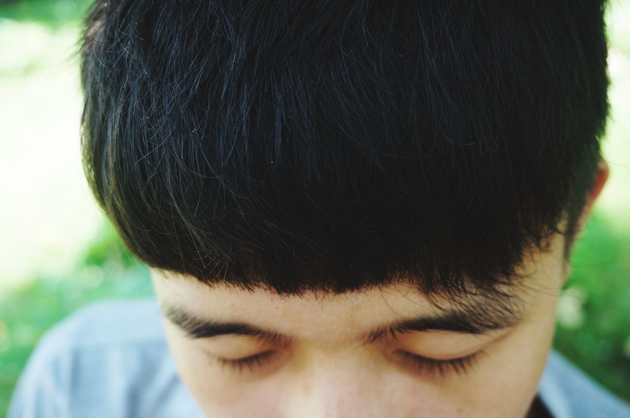 headshot, focus on foreground, close-up, lifestyles, leisure activity, human face, person, part of, portrait, looking at camera, head and shoulders, front view, young adult, human hair, men, day, outdoors