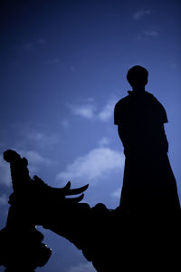 Low angle view of statue against sky