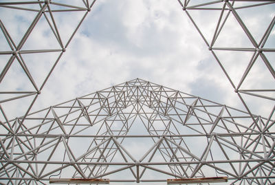 Low angle view of communications tower against sky