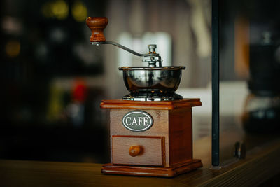 Close-up of coffee maker on table