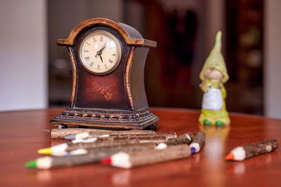 Close-up of clock on table