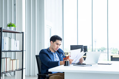 Full length of man working on table