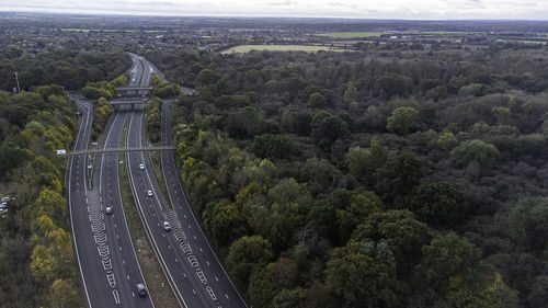 High angle view of road amidst trees in city