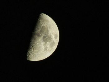 Low angle view of moon against sky at night