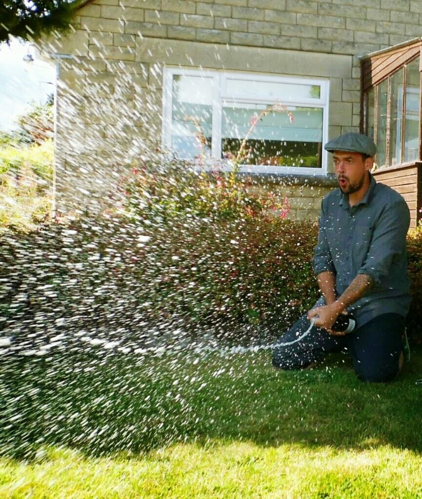 FULL LENGTH OF MAN STANDING AT LAWN IN YARD