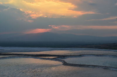 Scenic view of sea against sky at sunset