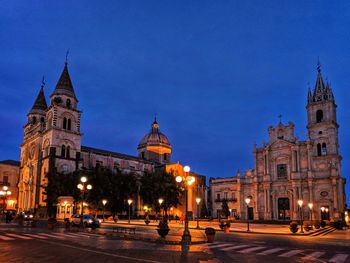 Illuminated buildings in city at night