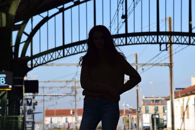 Woman standing against sky