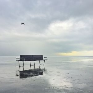 Scenic view of sea against cloudy sky