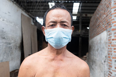 Asian men wearing protective face mask to prevent the spread of viruses