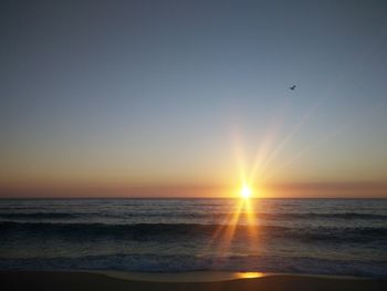 Scenic view of sea at sunset