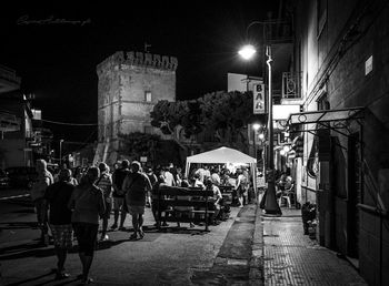 People on street at night