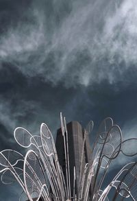 Low angle view of ferris wheel against sky