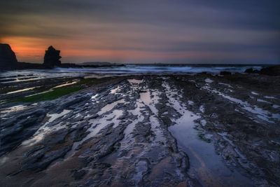 Scenic view of sea at sunset