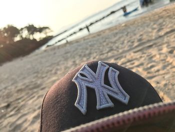 Close-up of metallic object on beach