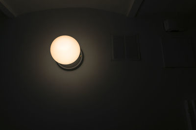 Low angle view of illuminated lamp