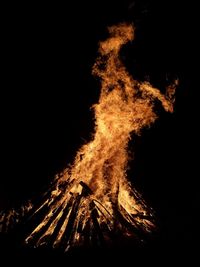 Low angle view of illuminated bonfire against sky at night