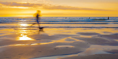 Scenic view of sea at sunset