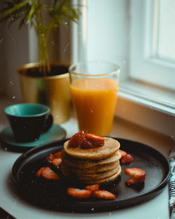 Close-up of breakfast served on table