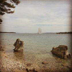 Scenic view of sea against cloudy sky