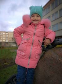 Portrait of girl standing in snow