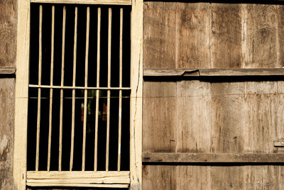 Full frame shot of window on wooden wall