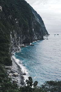 Blue tone scenic view of sea cliff against sky in taiwan, qingshui cliff