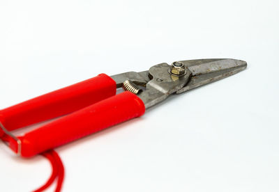 Close-up of machine part against white background