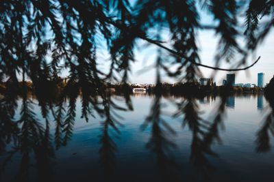 Scenic view of lake against sky at dusk