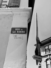 Low angle view of information sign on building