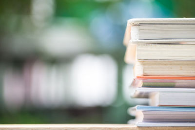 Stack of books on wooden table