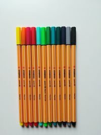 Close-up of multi colored pencils against white background