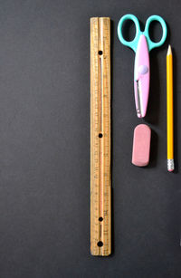 Close-up of multi colored objects on wooden table