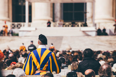 Rear view of people in town square