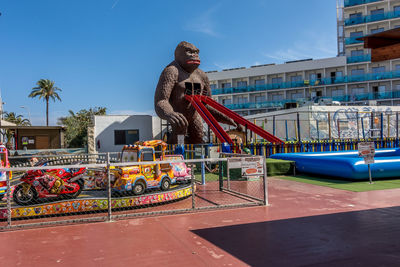 Statue against sky in city