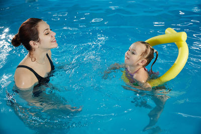 Portrait of woman swimming in pool