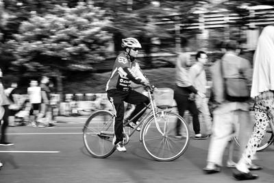 People riding bicycle on street