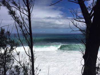 Scenic view of sea against cloudy sky
