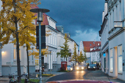 Street amidst buildings against sky