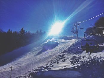 Scenic view of snow covered landscape against sky