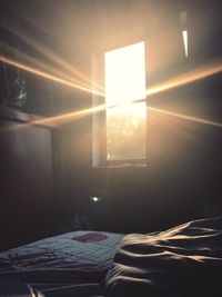 Close-up of sunlight on bed at home