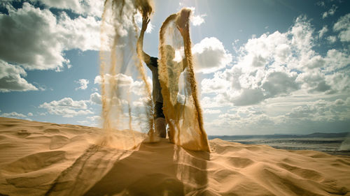 Panoramic view of desert against sky