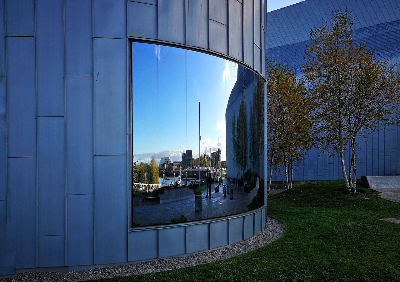 MODERN CITYSCAPE AGAINST SKY