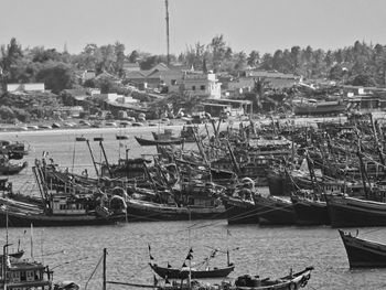 High angle view of sailboats moored at harbor