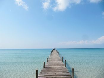 Pier over sea against clear sky