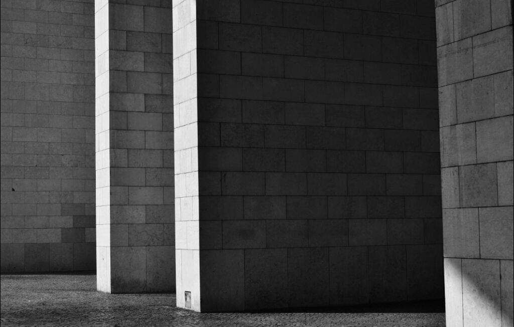 architecture, built structure, building exterior, brick wall, wall - building feature, wall, pattern, building, no people, window, outdoors, stone wall, sunlight, day, brick, old, textured, shadow, geometric shape, city