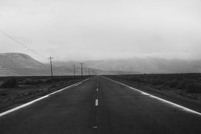 Empty road against clear sky