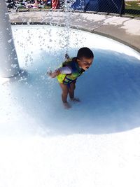 Boy playing in water