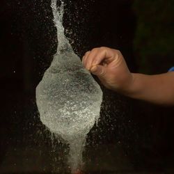 Close-up of person hand holding water